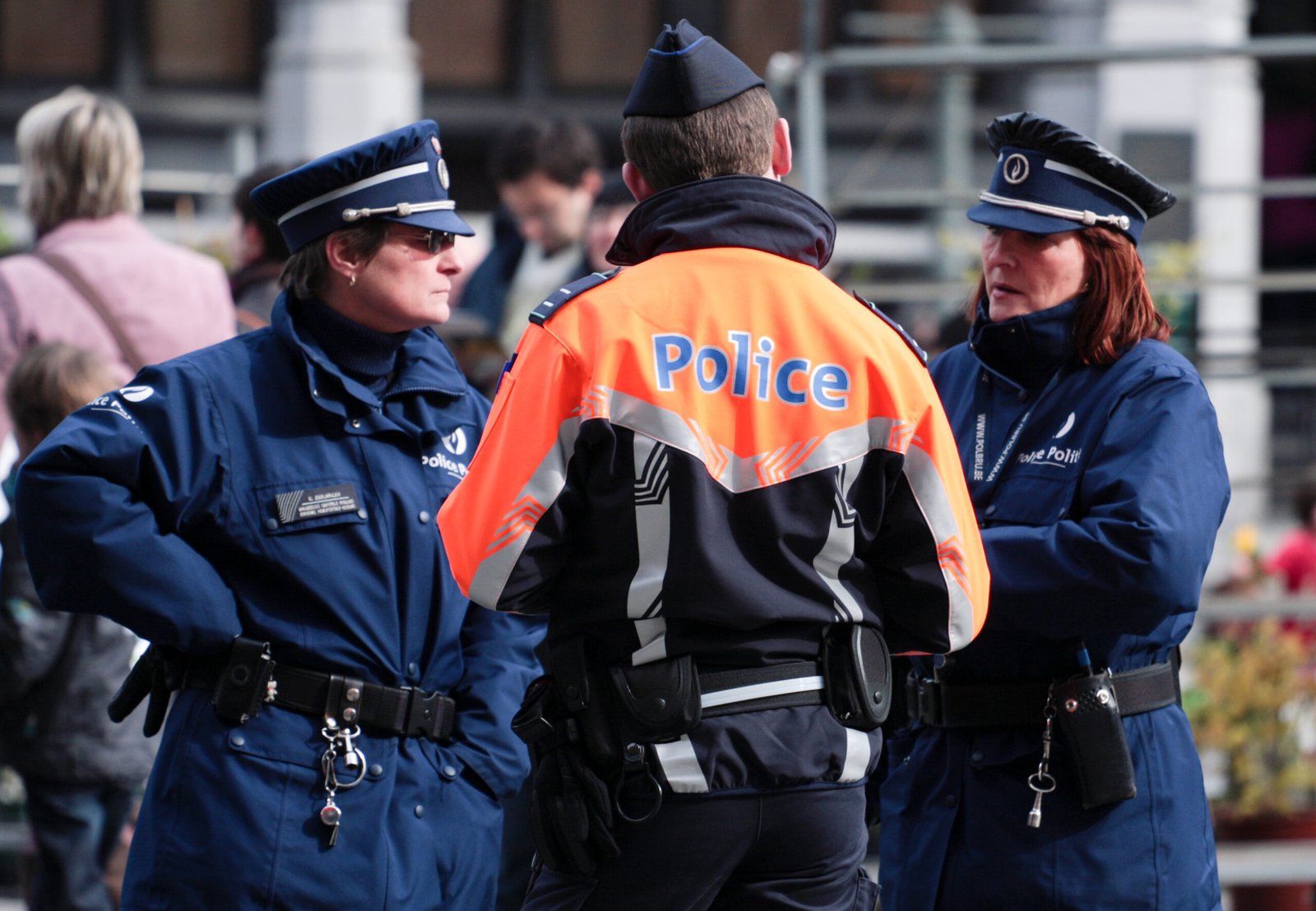 Three Brussels police officers in conversation